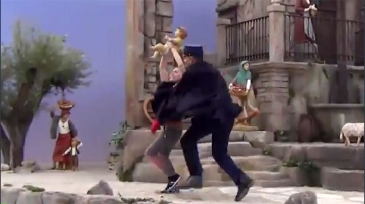 Femen trying to kidnap Baby-Jesus from the Vatican nativity scene.