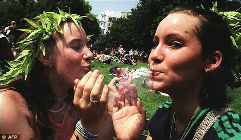 Two girls with marijuana garlands, members of the Pontifical Council for the Unity of Christians, enjoying a joint disconnection from harsh doctrinal reality.
